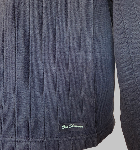 Ben Sherman Ribbed V-Neck Navy Blue Jumper close-up showing fabric texture and brand logo.