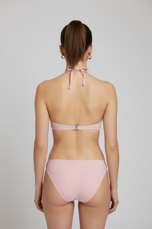 Woman wearing a pink bikini back view