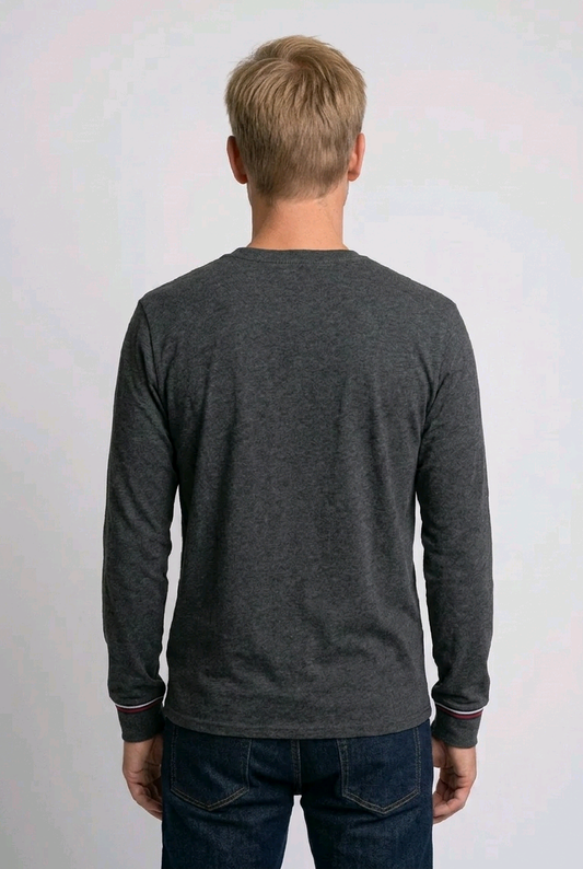 man wearing a dark grey fila sweatshirt