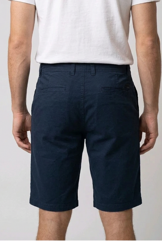man navy shorts and a white t-shirt back view