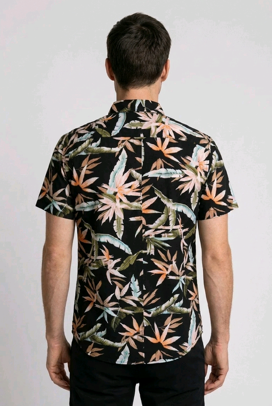 Man wearing a short-sleeve shirt with a colorful leaf
