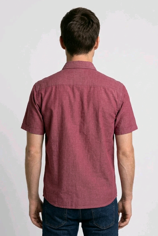 Man wearing a maroon short-sleeve shirt