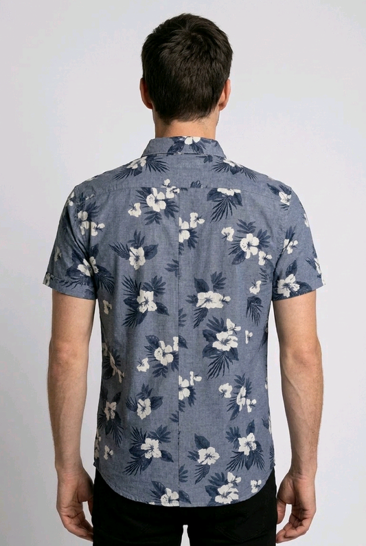 Man wearing a blue floral patterned shirt