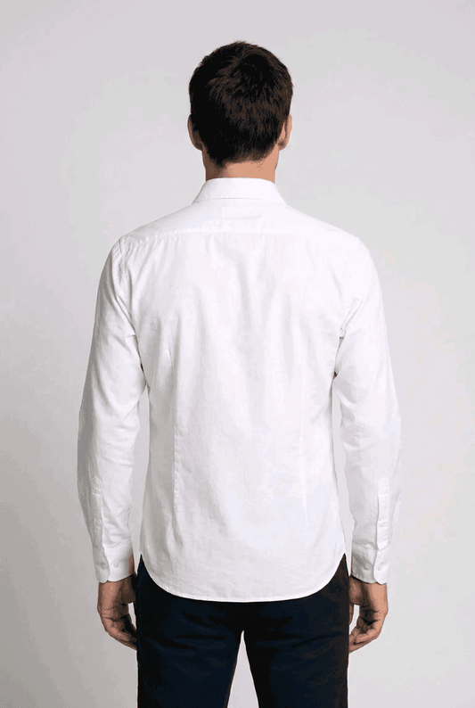 Man wearing a white formal shirt and dark trousers