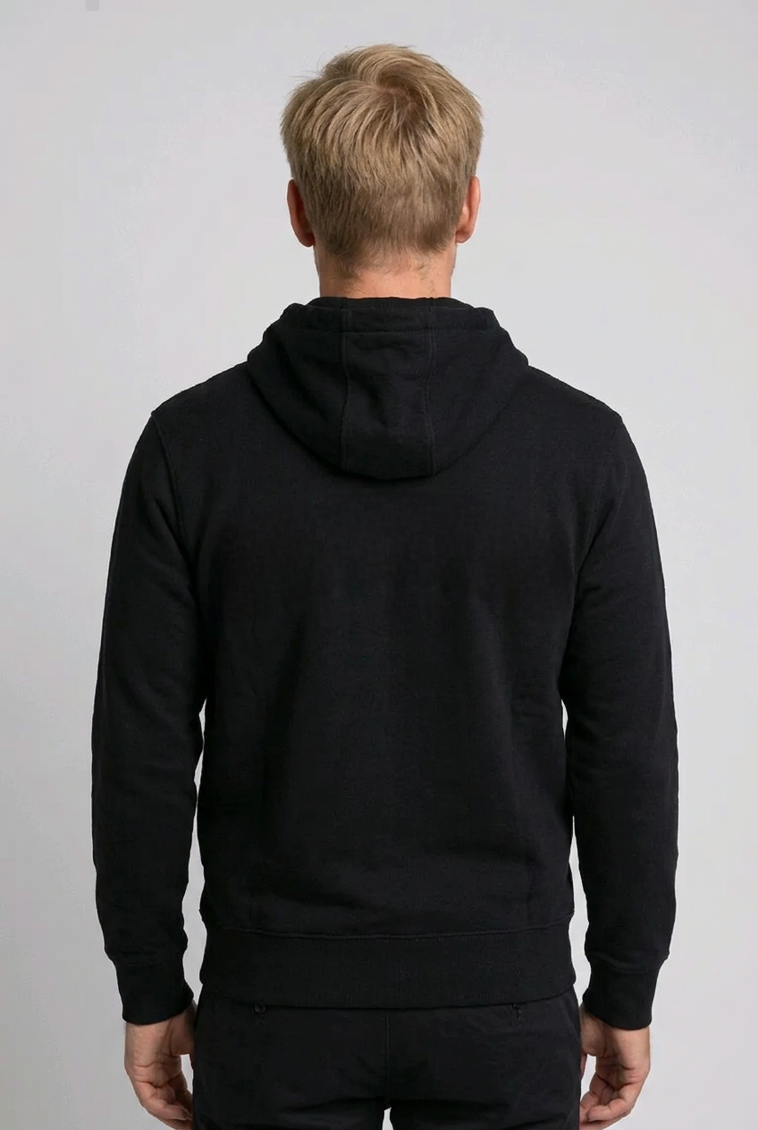 Man wearing a black hoodie from behind