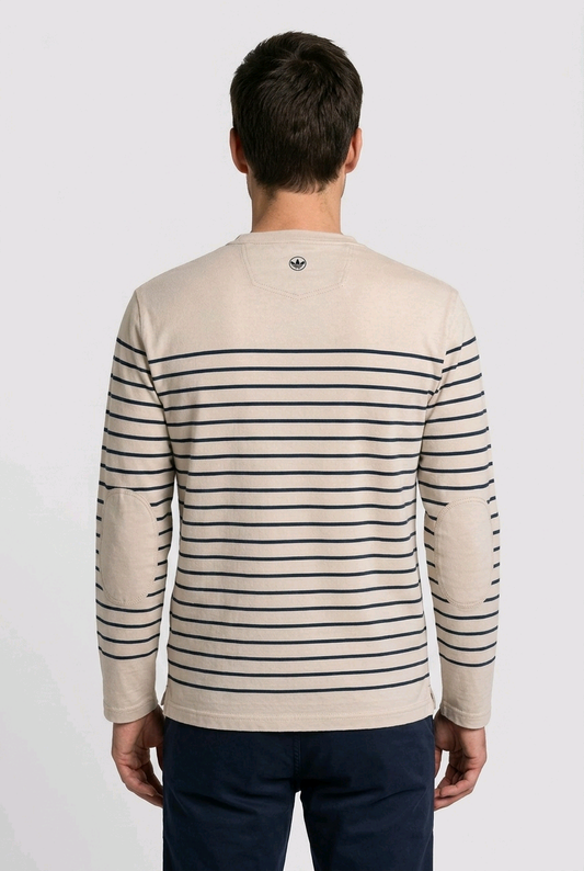 Man wearing a beige sweater with black stripes from behind