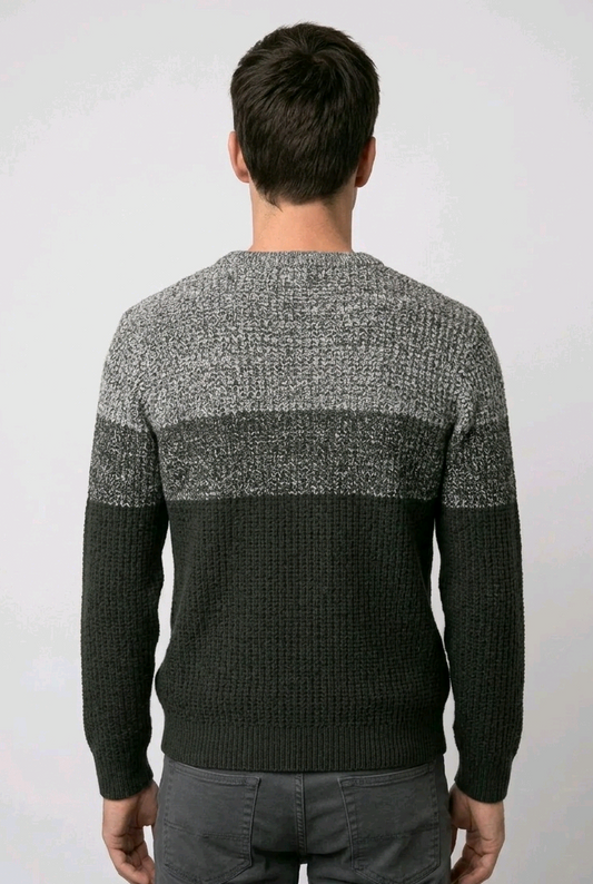 Man wearing a gray and dark green sweater