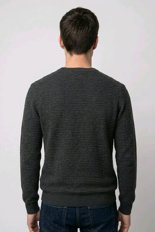Man wearing a black textured jumper