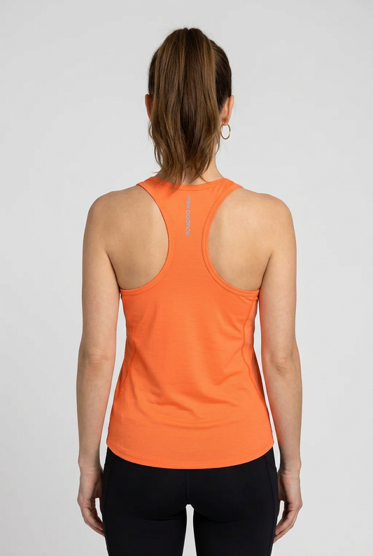 Woman wearing an orange tank top
