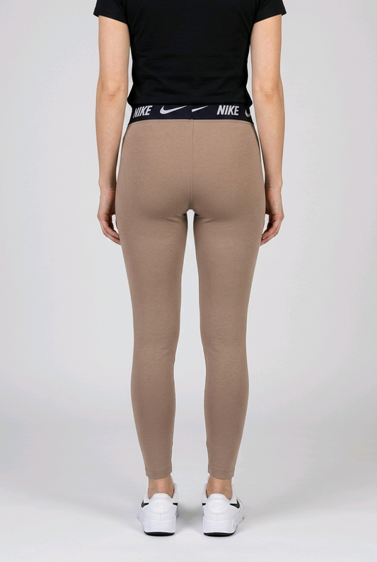Person wearing beige Nike leggings with a black t shirt