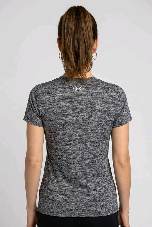 Woman wearing a gray under armour t-shirt back view