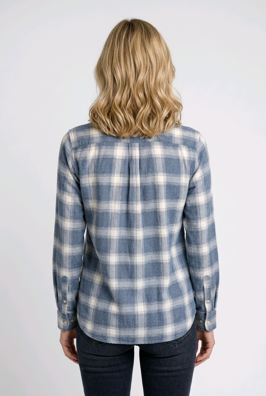 Woman wearing a blue and white plaid shirt