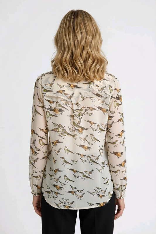 Woman wearing a blouse with bird pattern