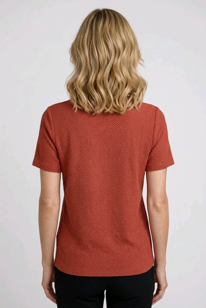 Woman wearing a red textured shirt back view