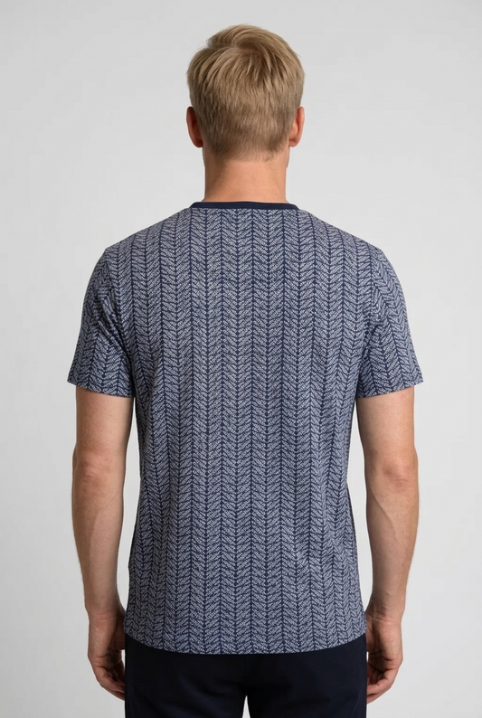 Person wearing a blue patterned t-shirt