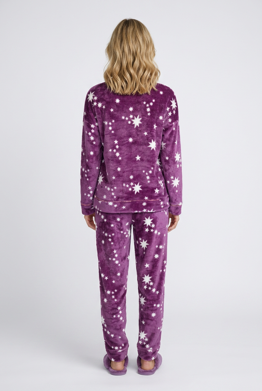 Woman wearing purple pajamas with star pattern