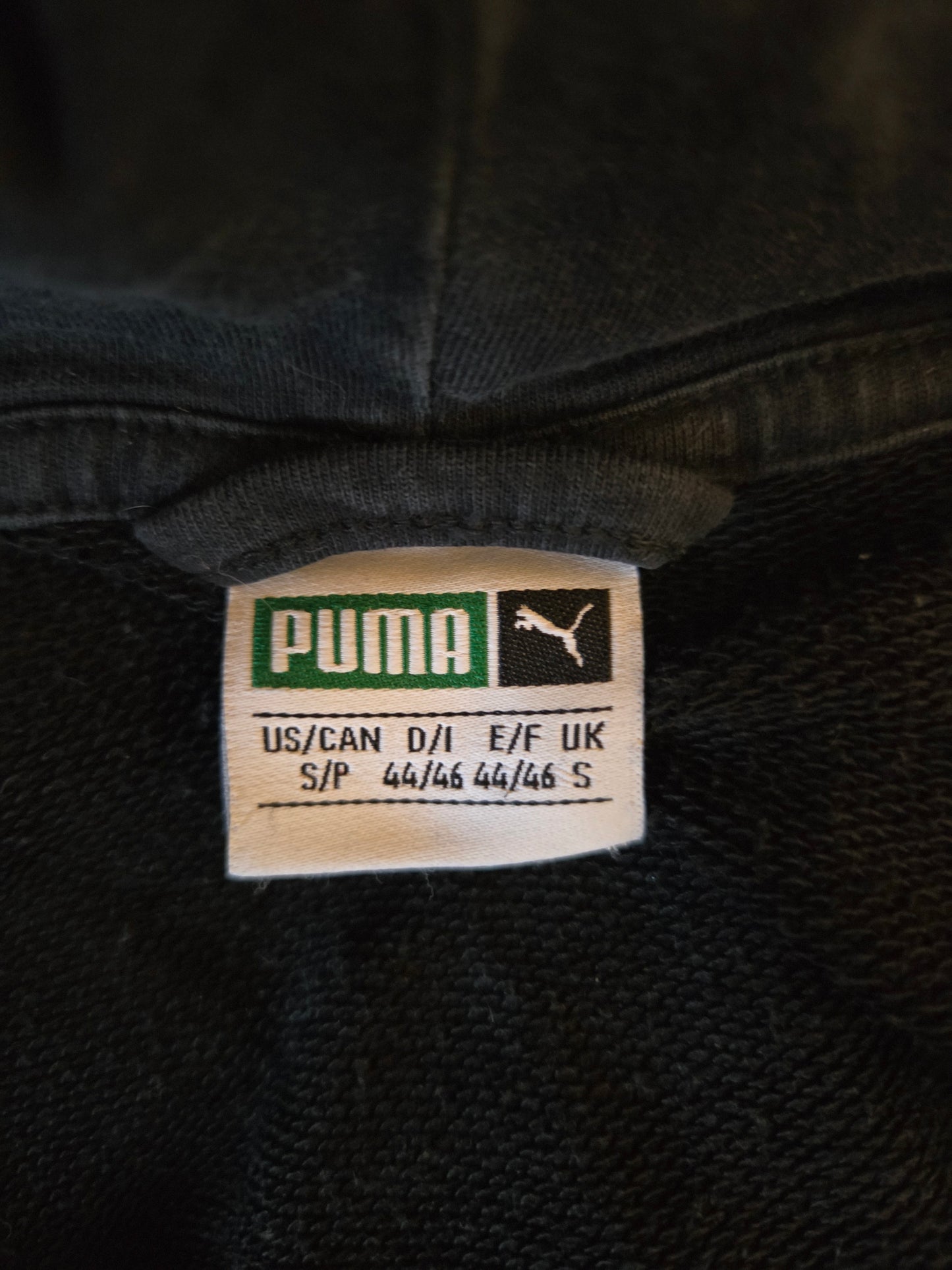 Puma black hoodie label with size details