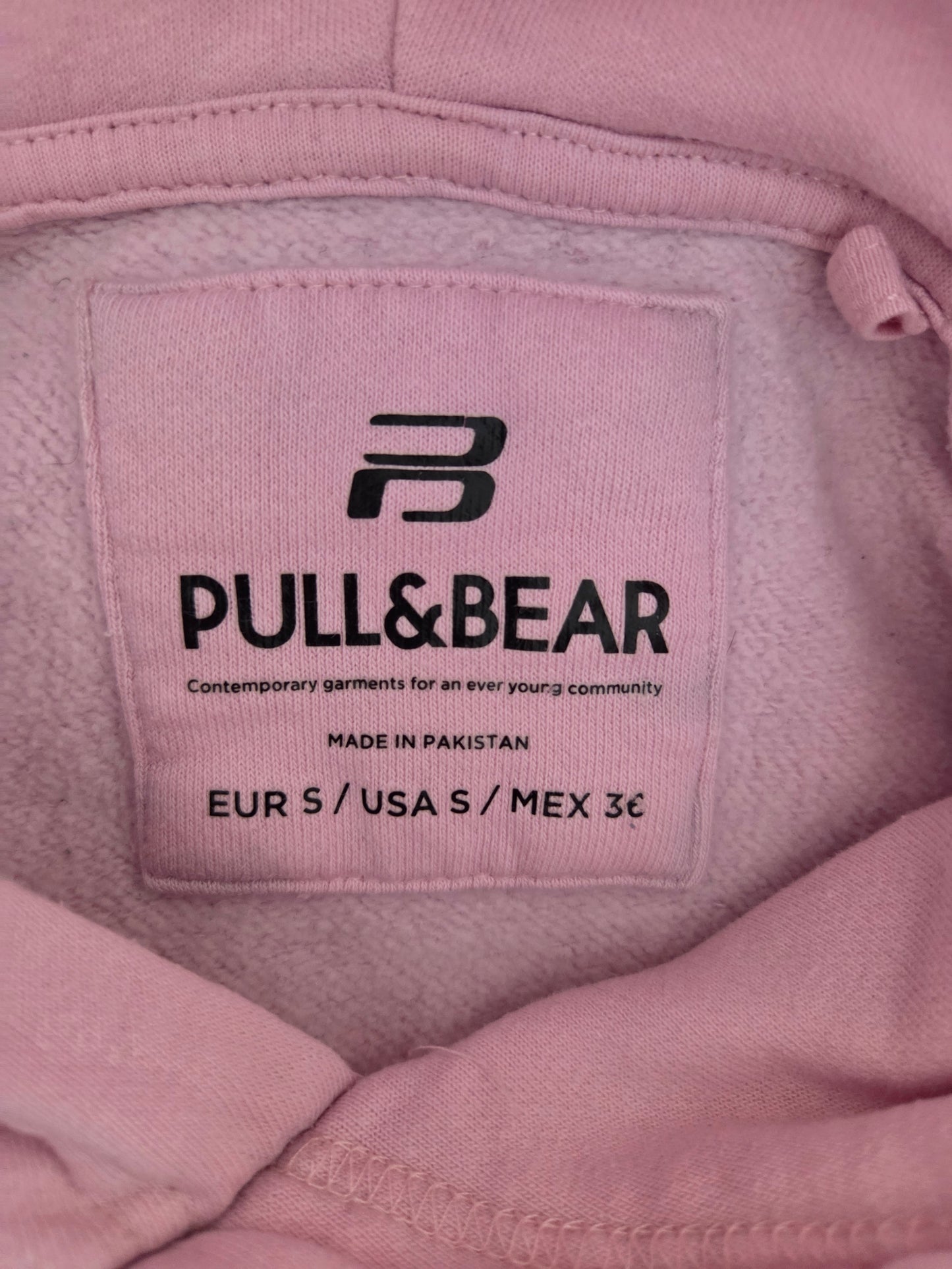 Pink Pull & Bear hoodie label with size and country of origin