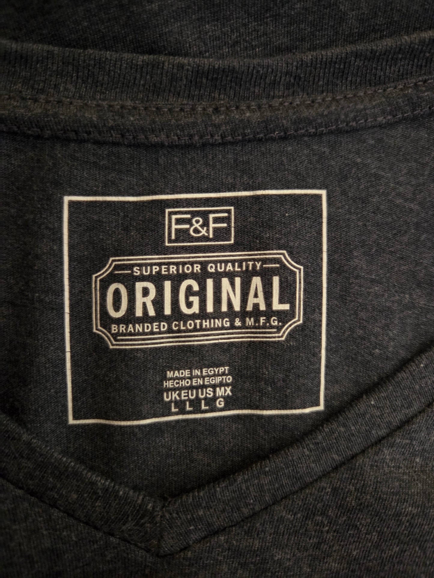 Close-up of a branded label on a dark fabric background