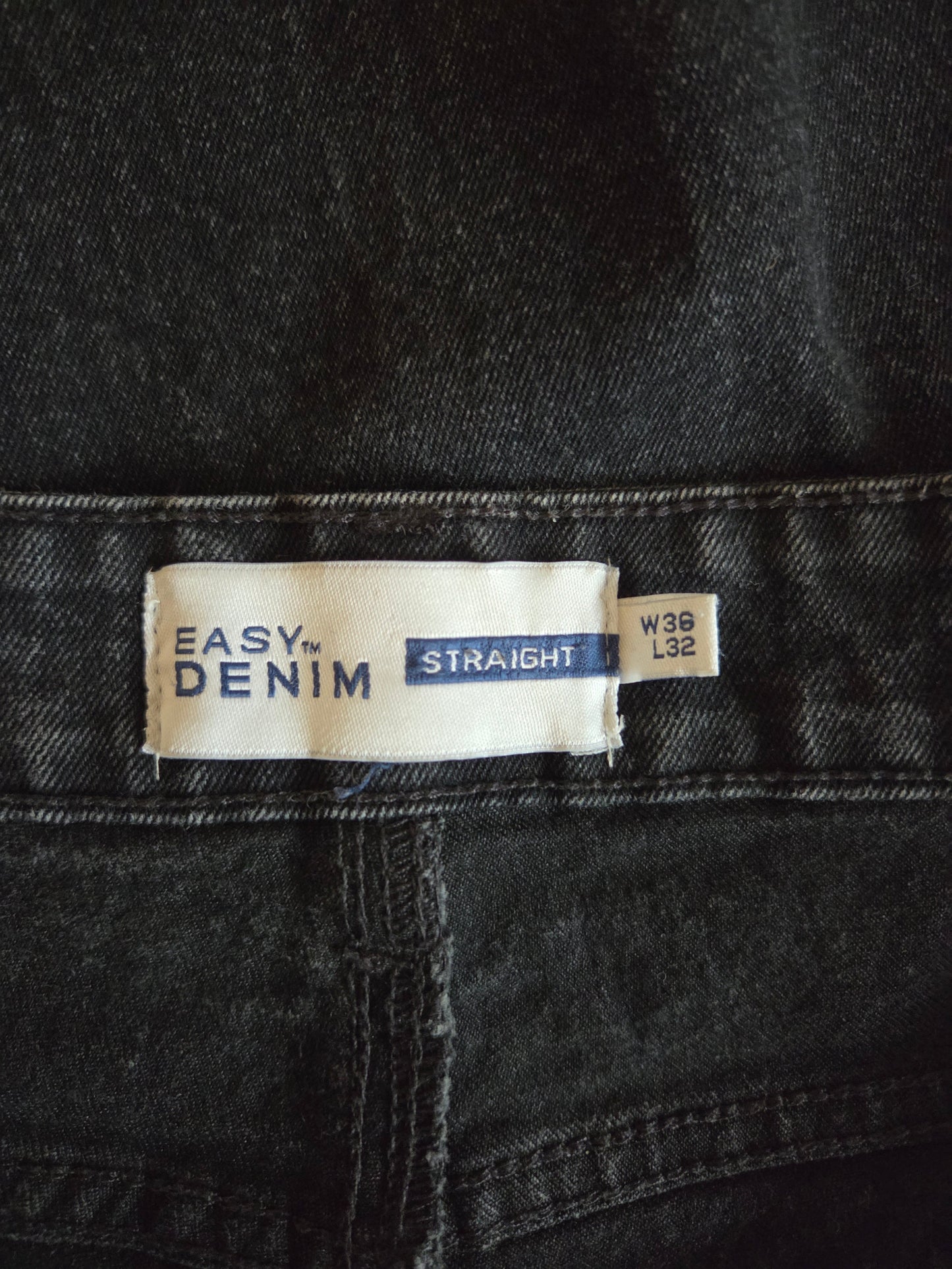 Size label on a pair of black jeans