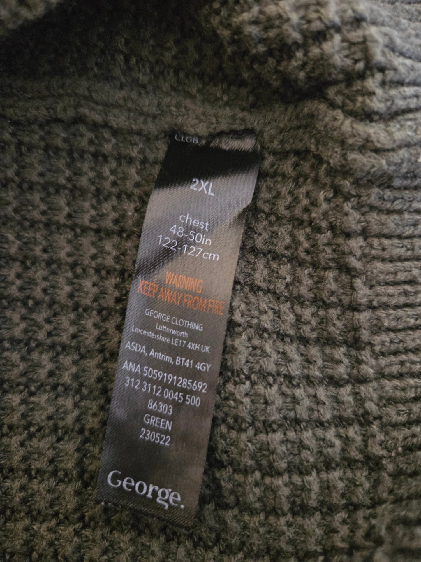 Clothing tag on a textured fabric background