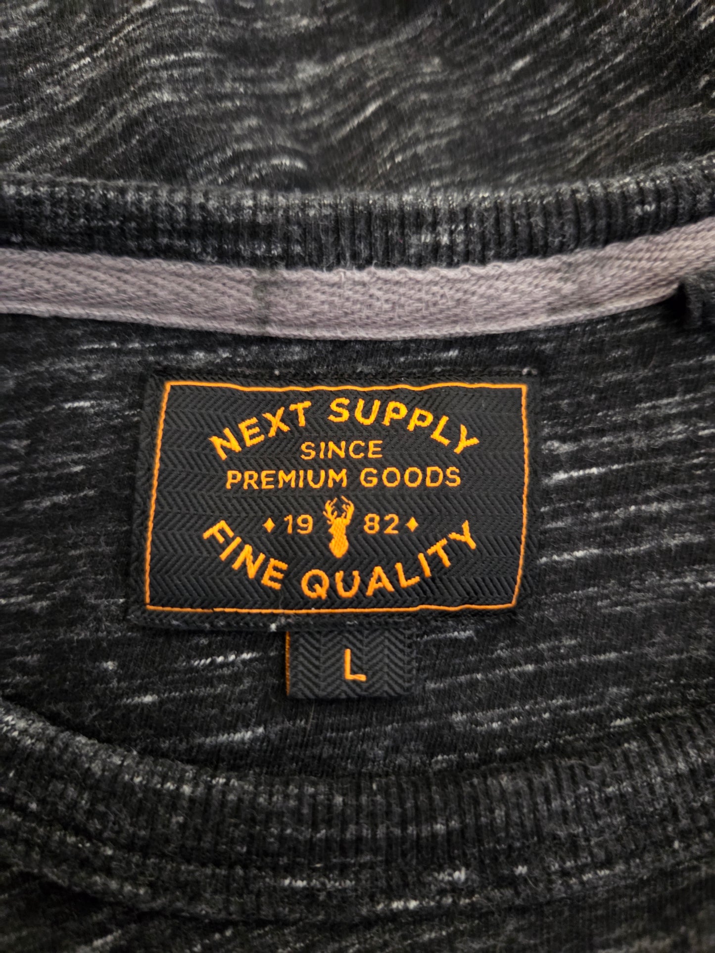 Close-up of a label on a textured fabric background