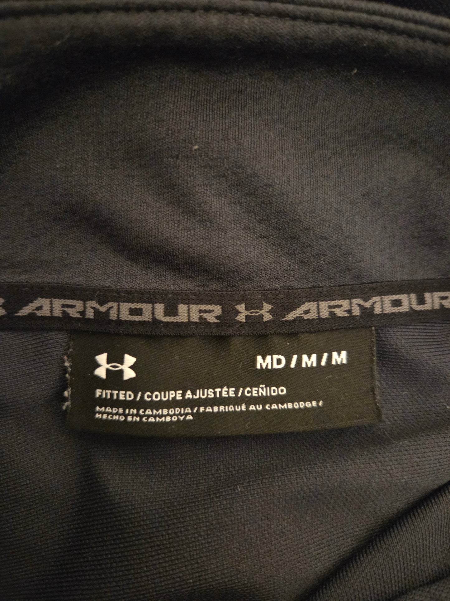 Close-up of Under Armour label on a black garment
