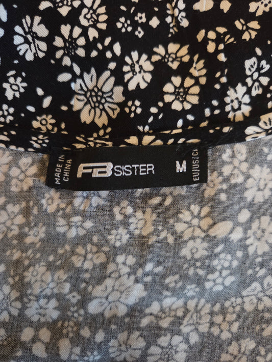 Floral patterned fabric with 'FB Sister' label