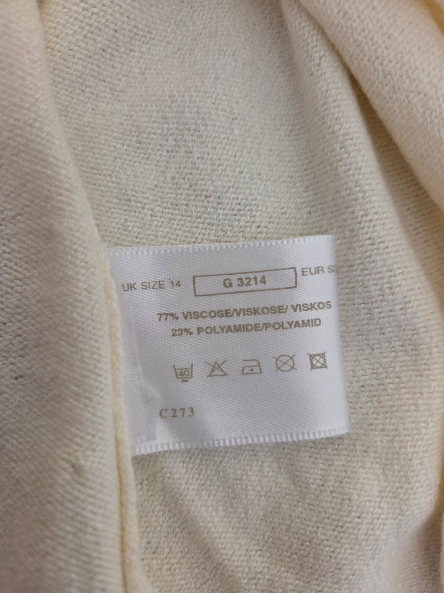 Fabric label on a beige fabric background