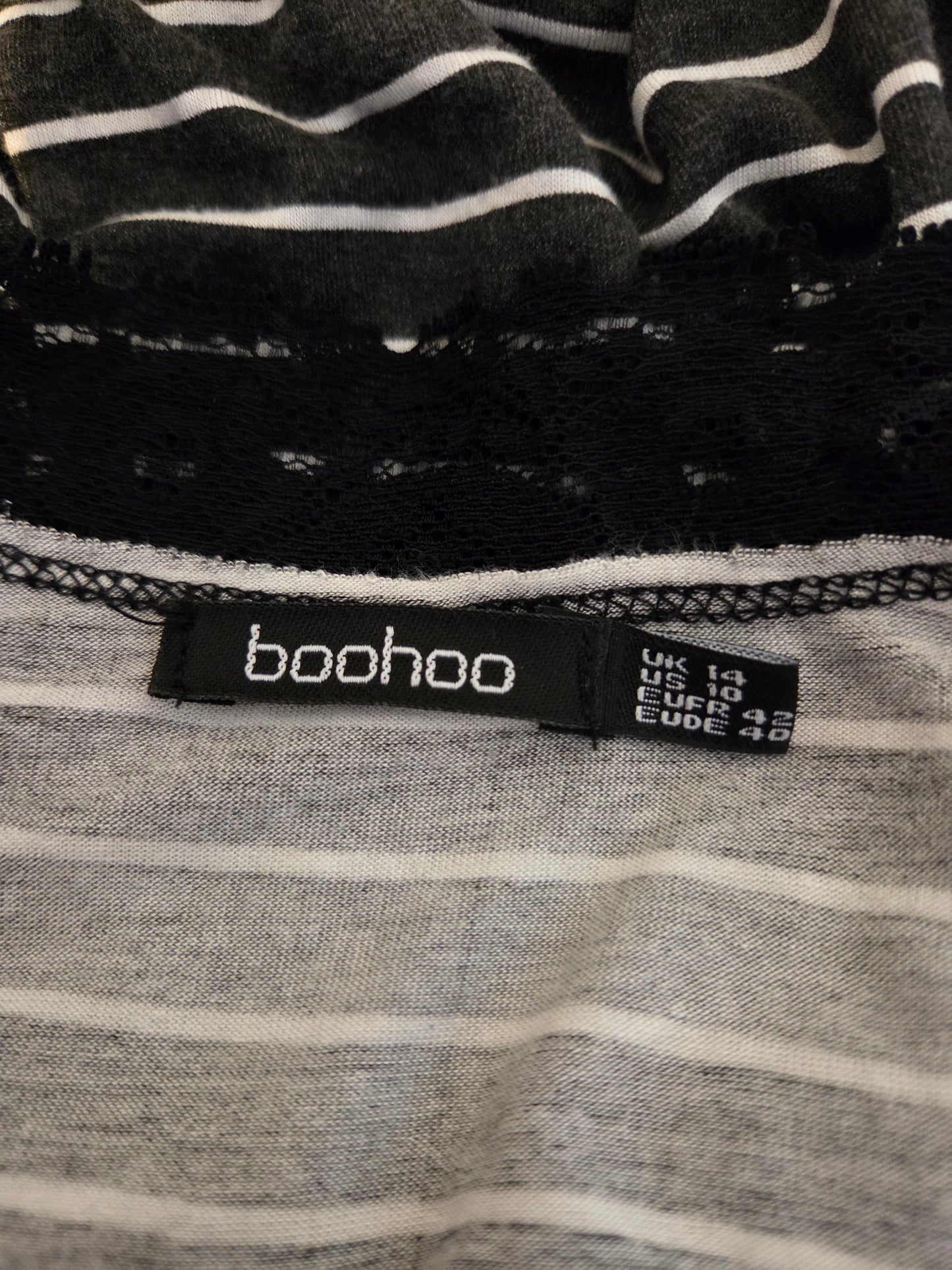 Boohoo label on a black and gray striped garment