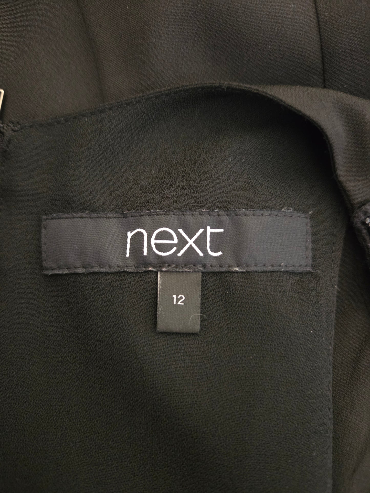 Close-up of Next size label