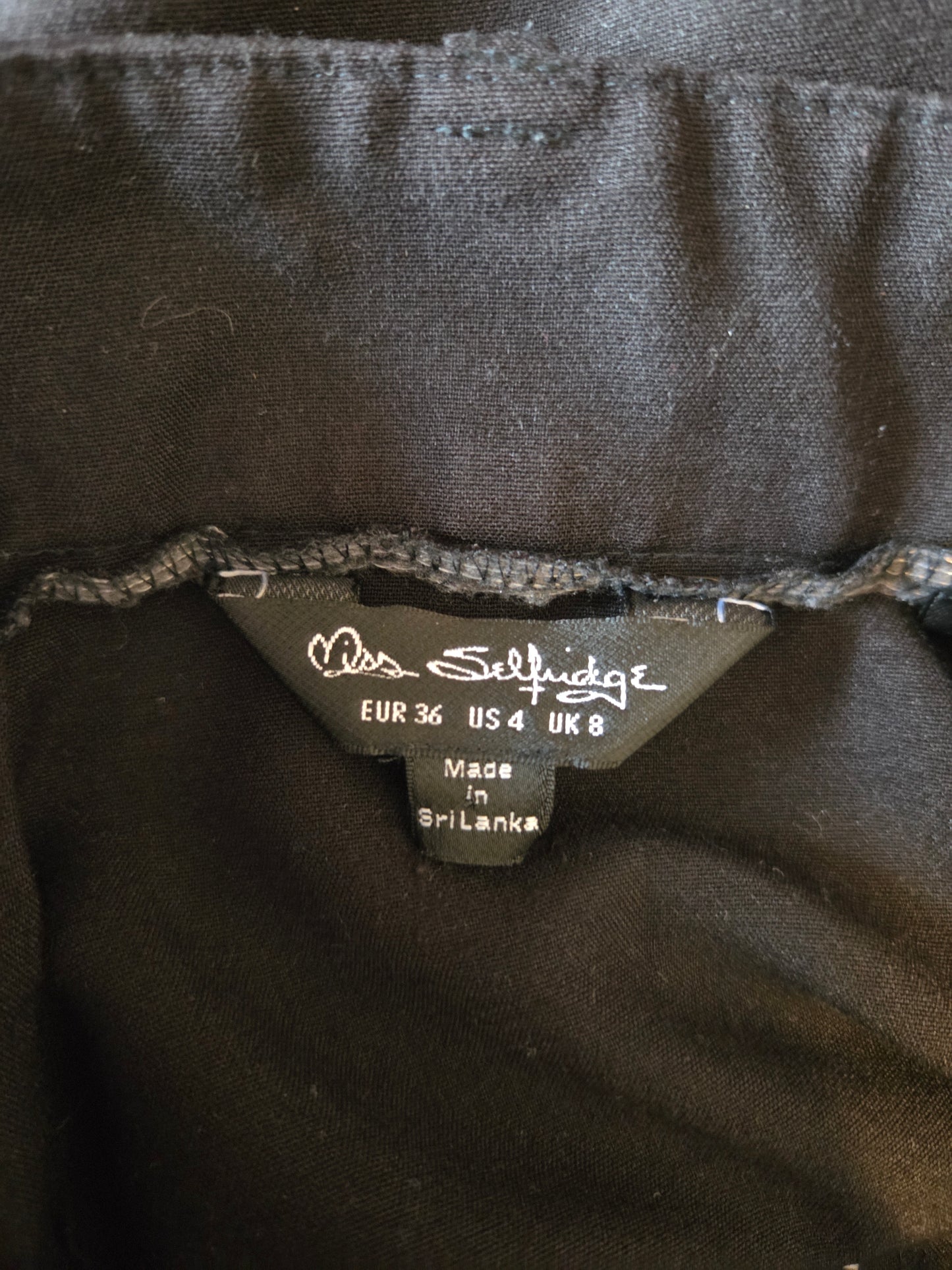 Clothing label on a dark fabric background