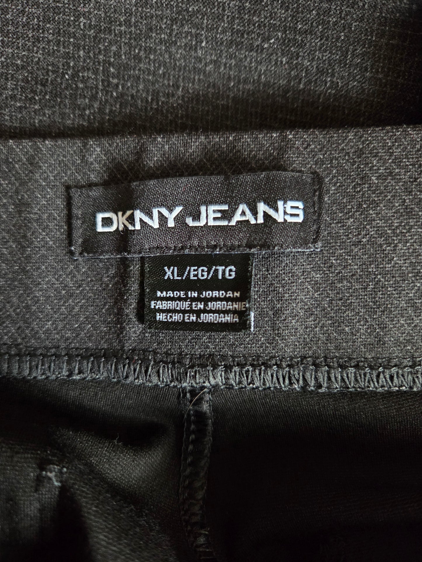 DKNY Jeans label on a fabric background