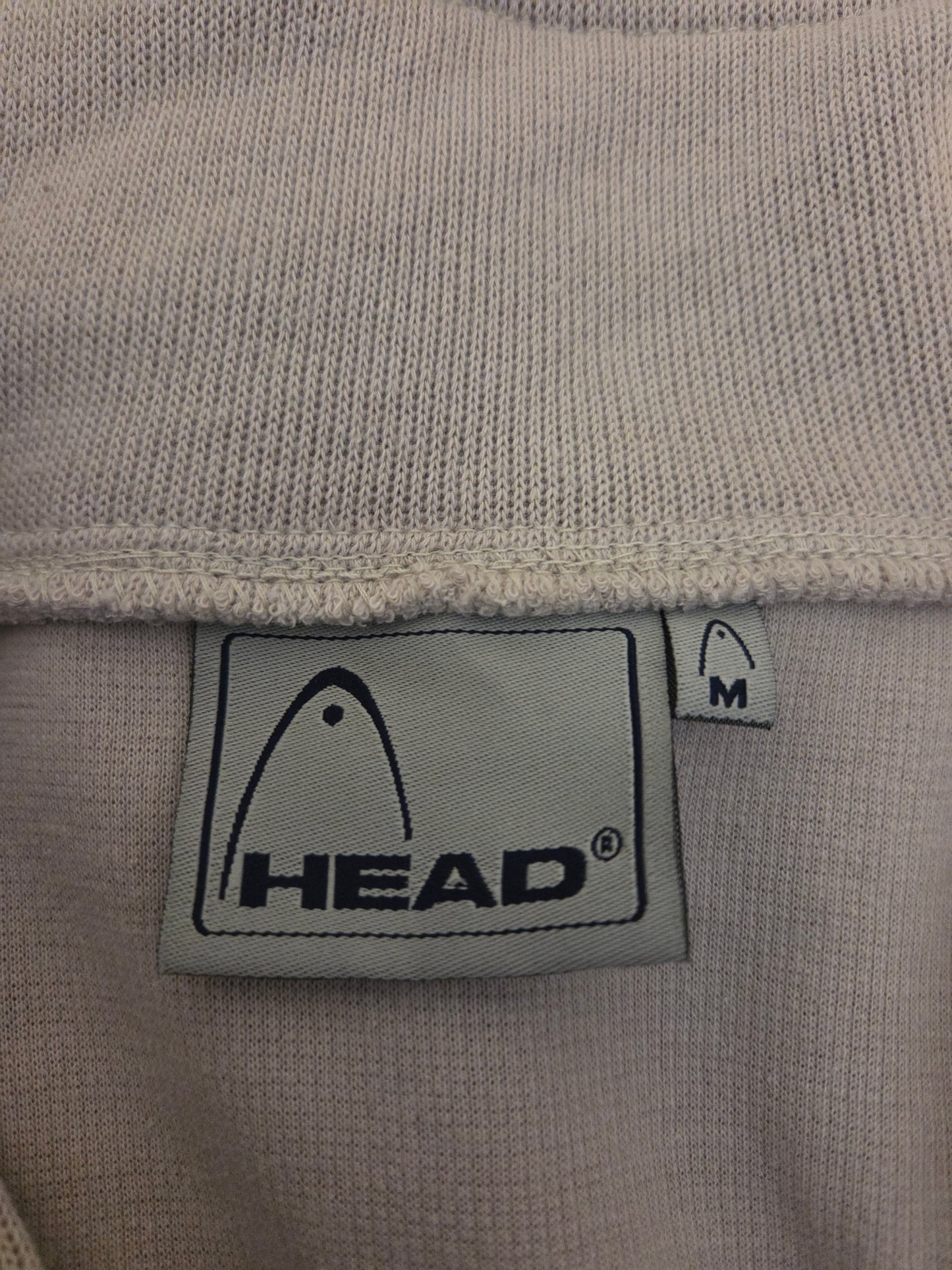 beige fabric with a HEAD size label