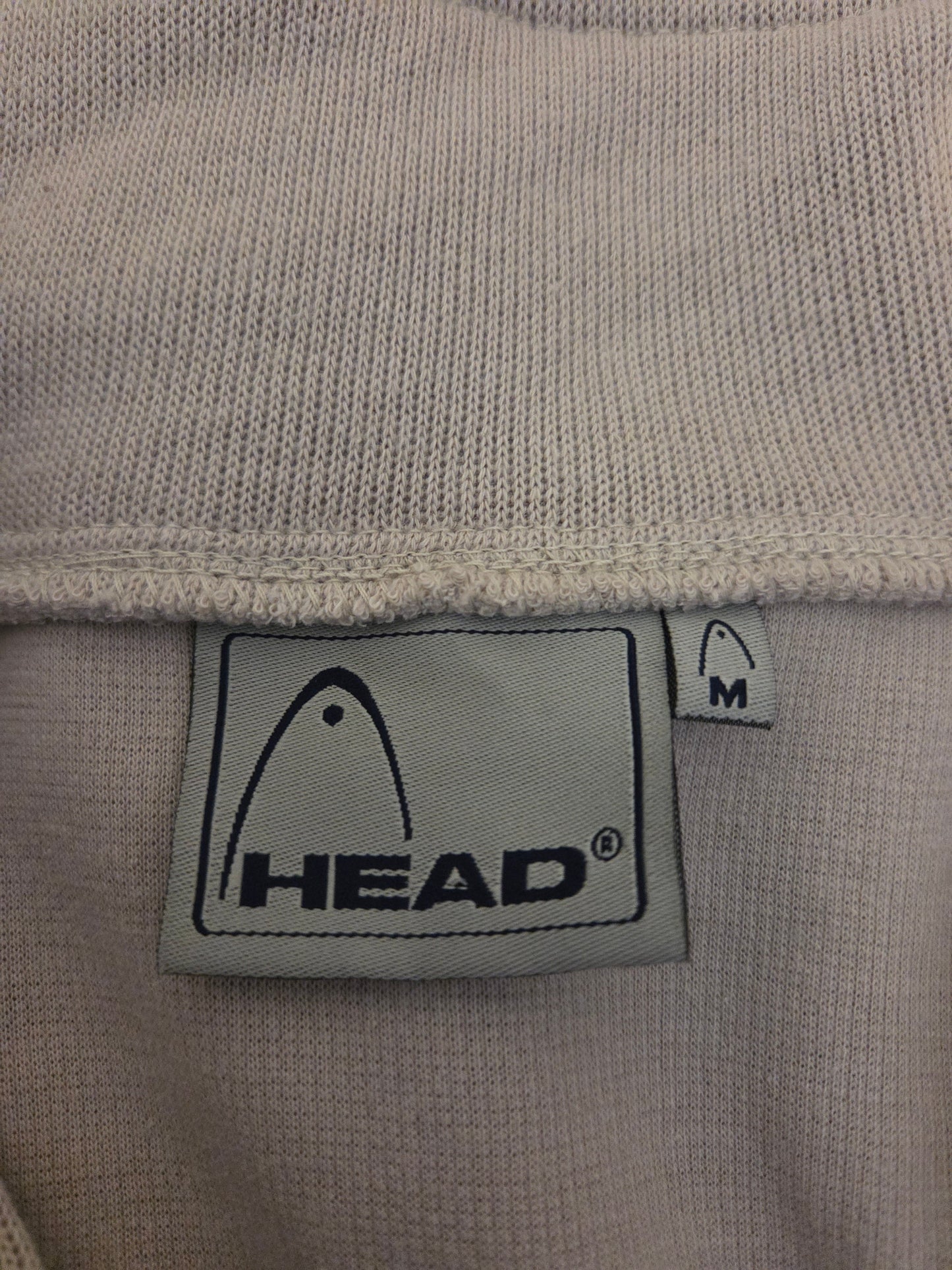 beige fabric with a HEAD size label