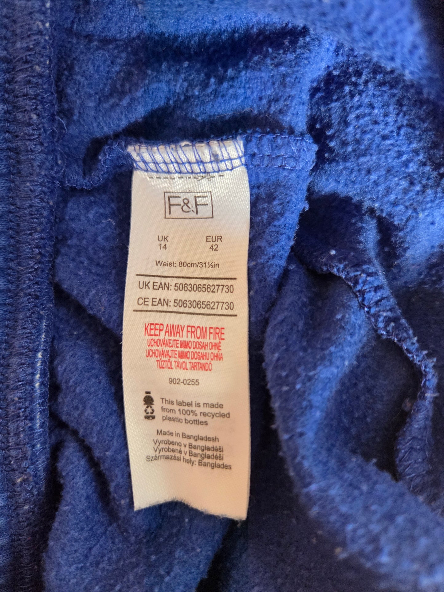 Close-up of a blue fabric texture with a visible label.