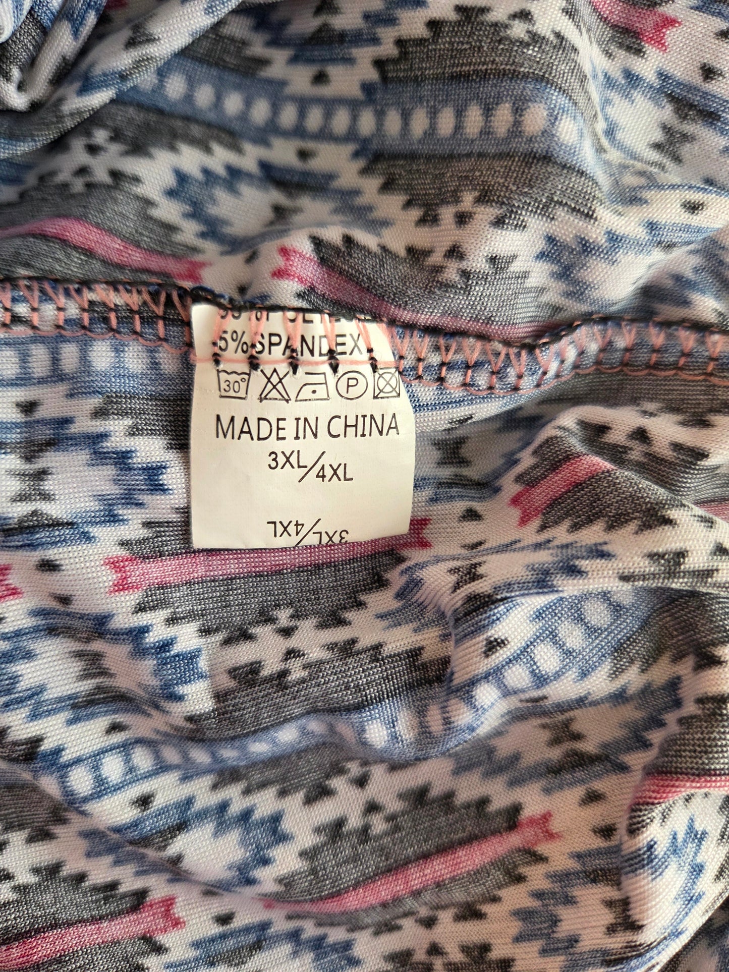 Fabric with a patterned label indicating 'Made in China' and size information.