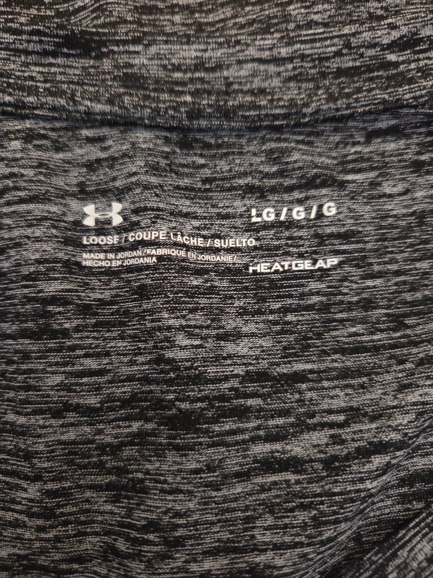 Under Armour size label on a grey marl t shirt