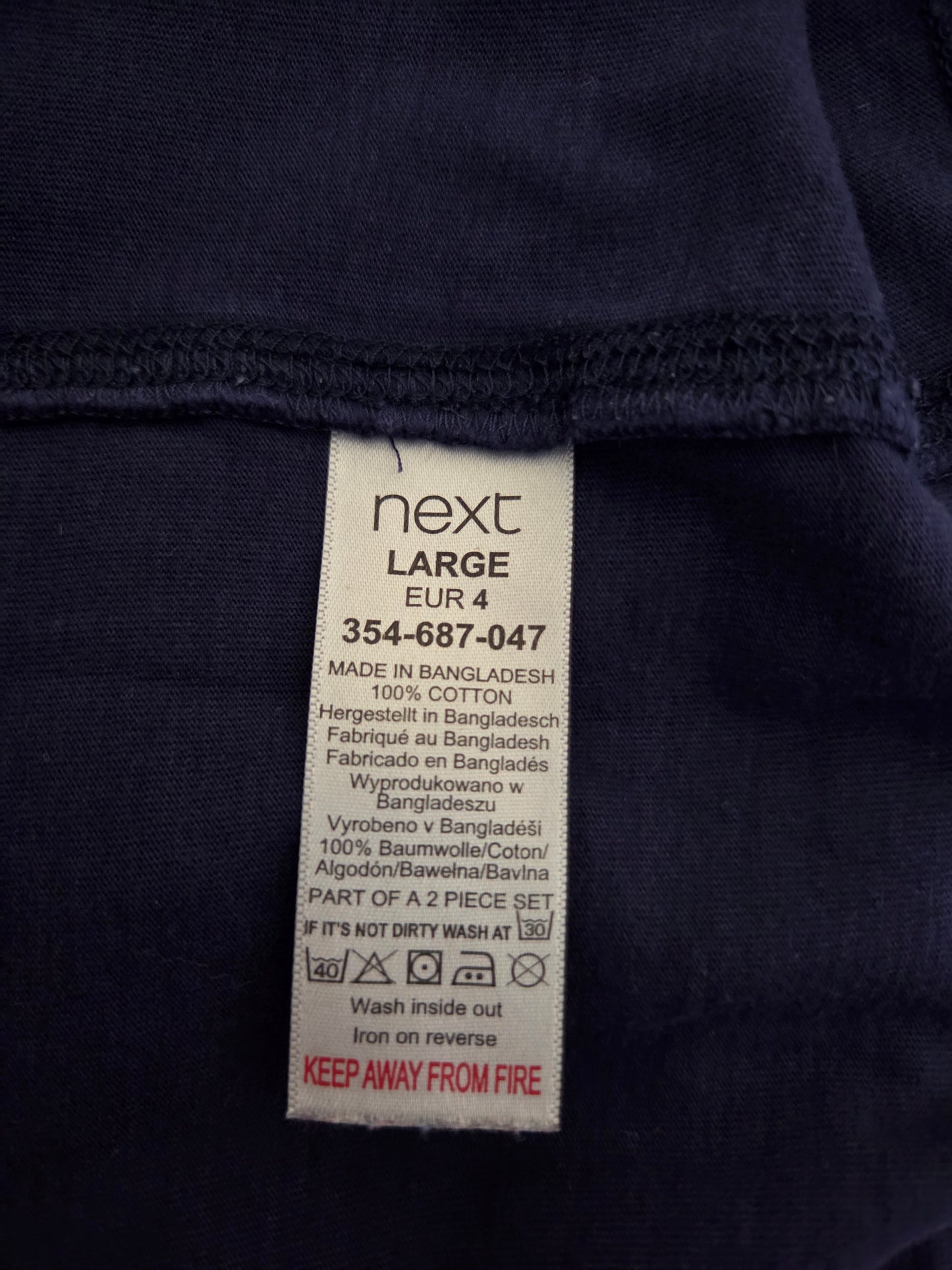 Navy blue garment with a visible size label