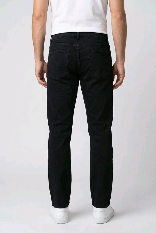 Man wearing black jeans and a white shirt