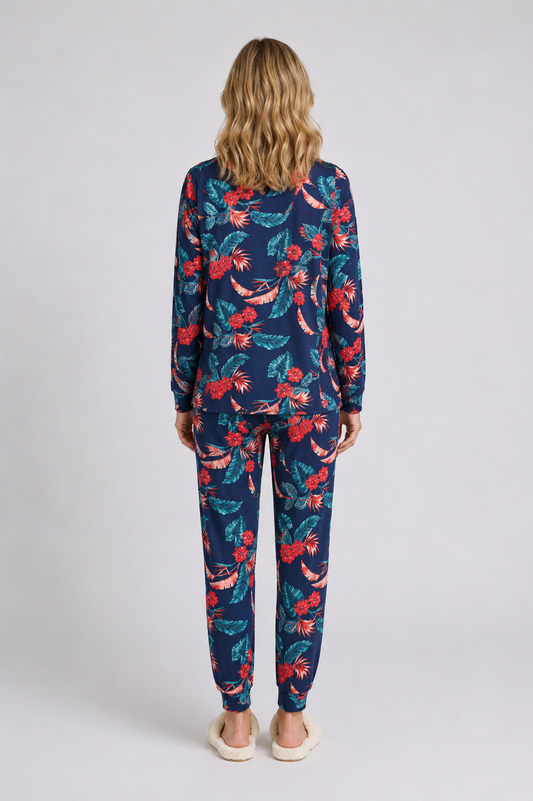 Woman wearing a navy floral pajama set