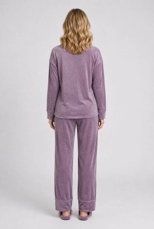 Person wearing a purple velour pyjama set