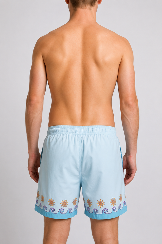 Light blue swim shorts with wave and sun design