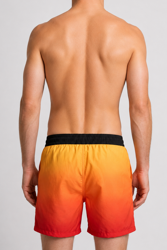 Man wearing orange to red gradient swim shorts