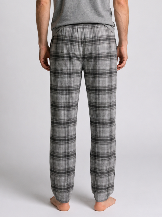 Man wearing grey plaid pajama pants