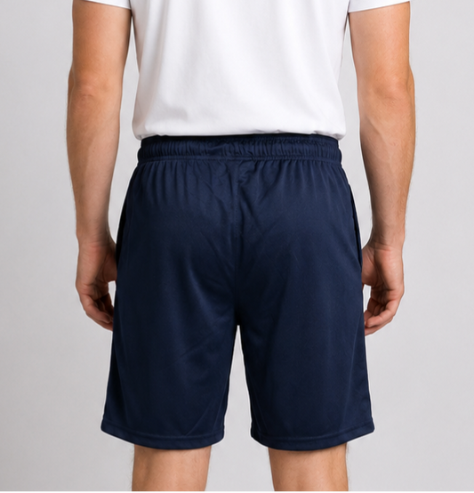 Man wearing navy Reebok shorts and a white t-shirt