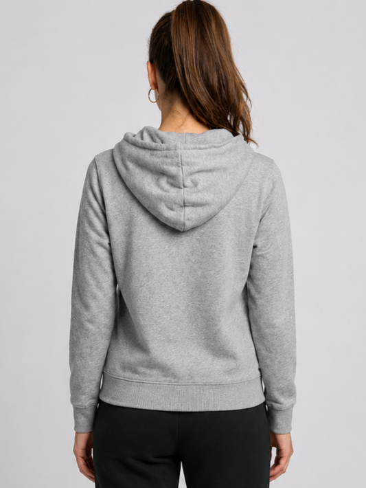 Woman wearing a grey reebok hoodie from behind