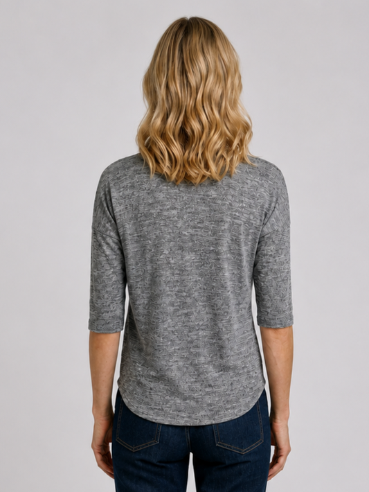 Woman wearing a grey top