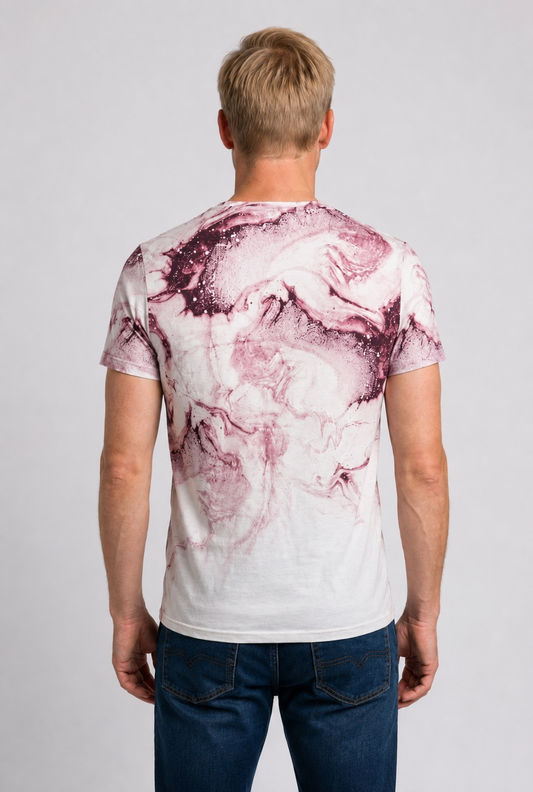 Person wearing a white t-shirt with pink marble pattern on the back