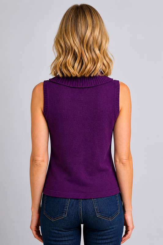 Woman wearing a purple sleeveless top and blue jeans